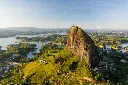 aerial-view-of-piedra-del-penol-with-mountains-in-the-background-guatape-antioquia-colombia-AAEF09017.webp